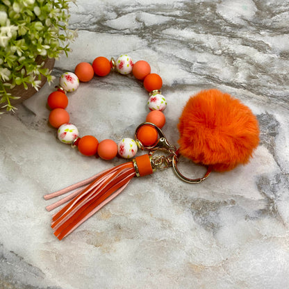 Silicone Bracelet Keychain - Tassel & Pom Pom- Orange & Floral